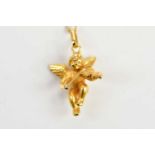 An 18ct yellow gold pendant modelled as a cherub playing violin, approx 2.2g.
