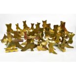 A large collection of brass mantel shelf boots, approx twenty-six pairs.