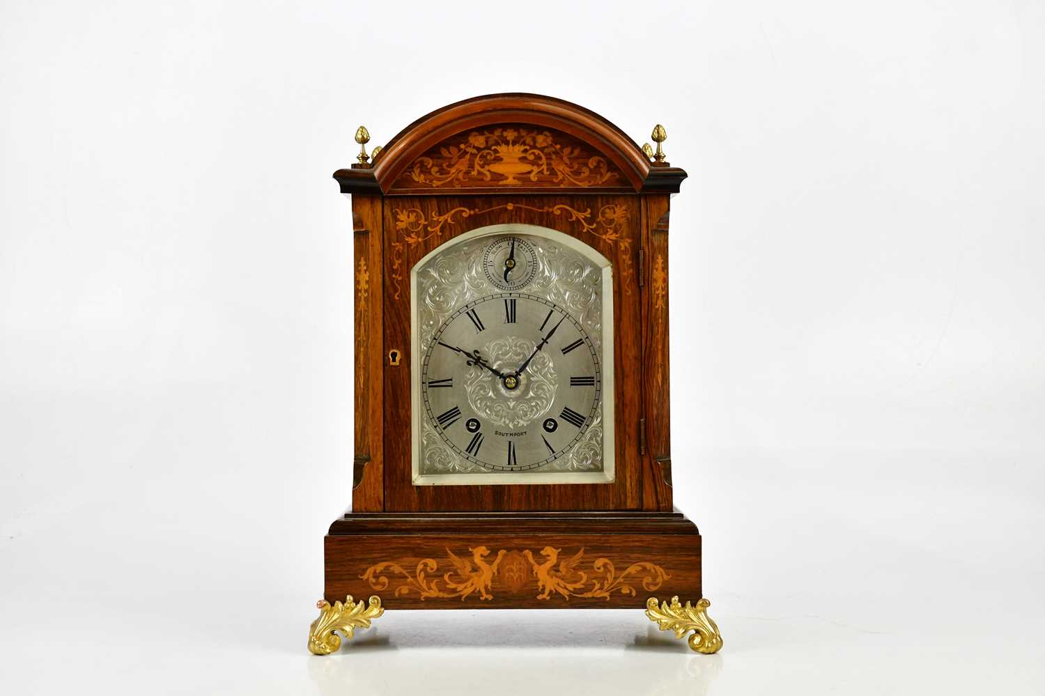 A late 19th century inlaid rosewood bracket clock, with four gilt metal finials above the silvered