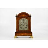 A late 19th century inlaid rosewood bracket clock, with four gilt metal finials above the silvered