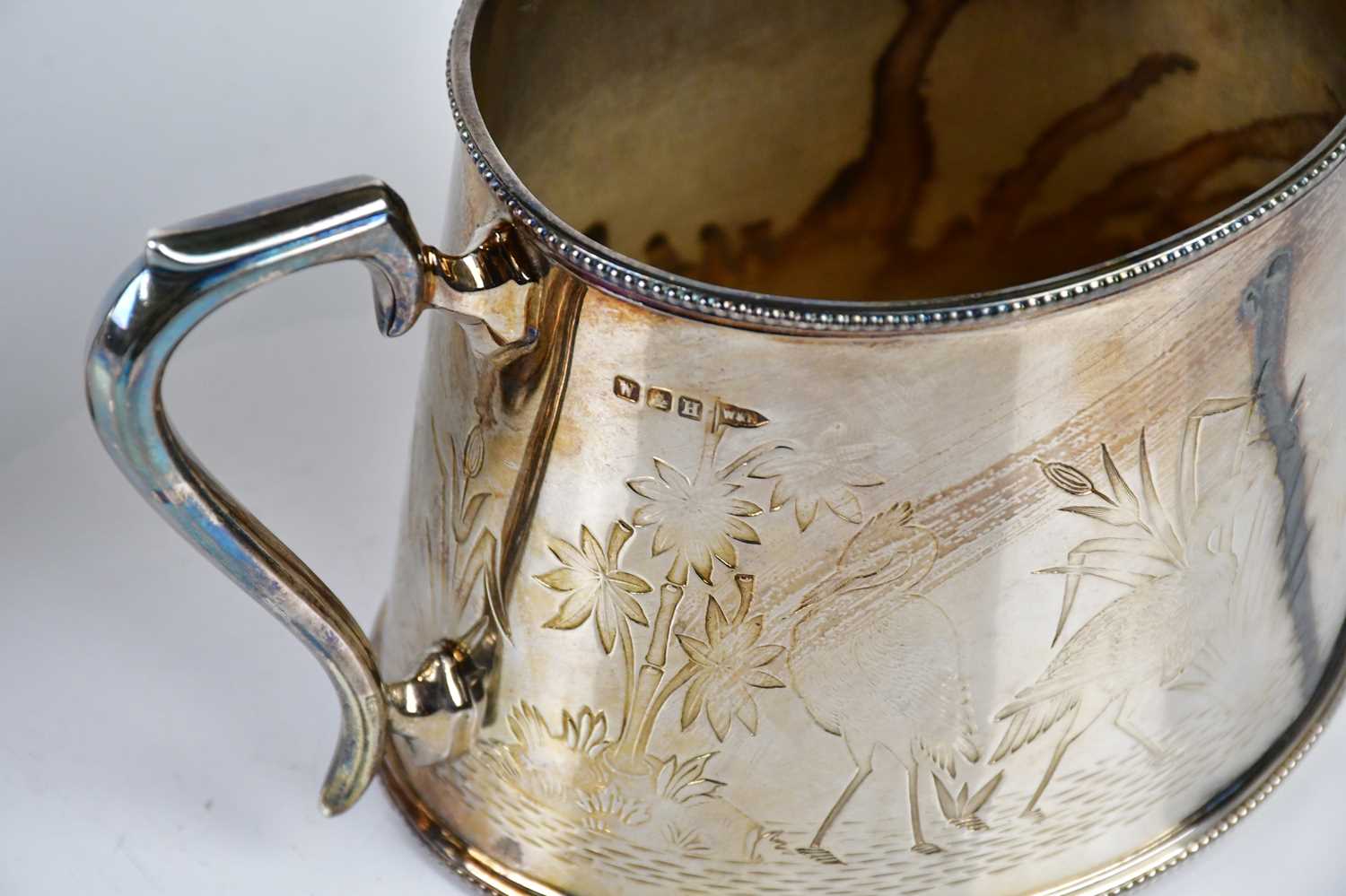 WALKER & HALL; a silver plated twin handled sugar bowl and cream jug chased with cranes in the - Image 3 of 3