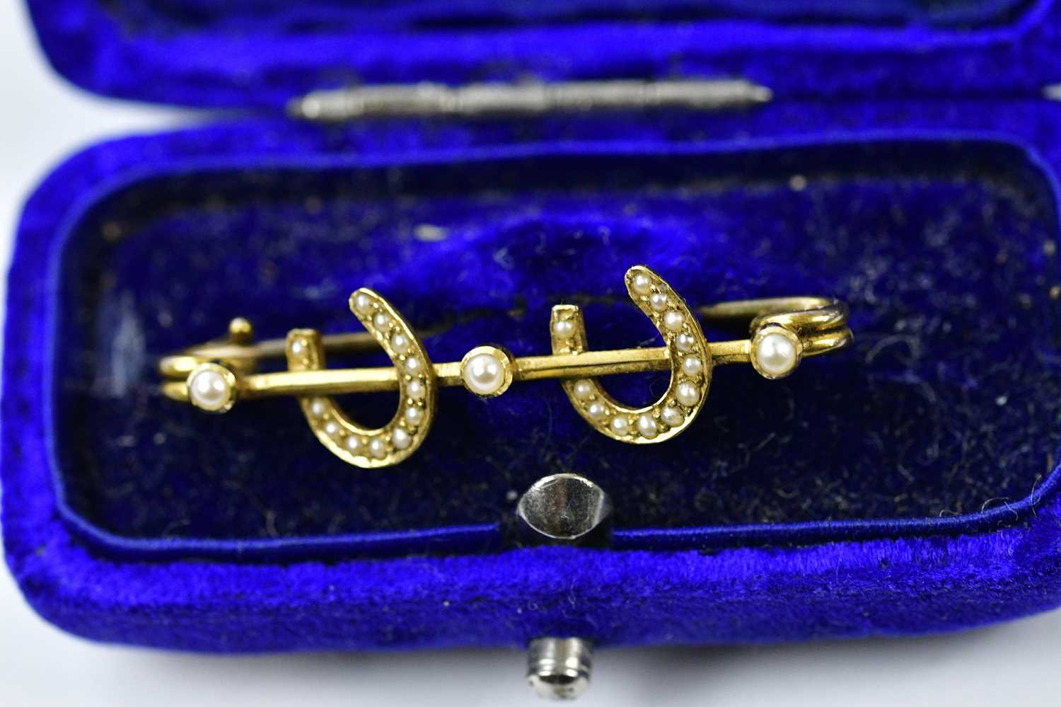 A Victorian yellow metal and seed pearl bar brooch, set with two horse shoes, a further brooch - Image 3 of 4