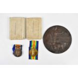 A WWI bronze memorial plaque awarded to William Arthur Albinson and two WWI medals comprising