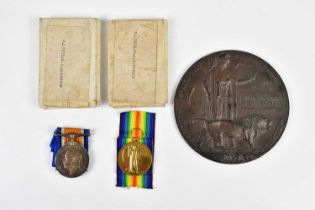 A WWI bronze memorial plaque awarded to William Arthur Albinson and two WWI medals comprising