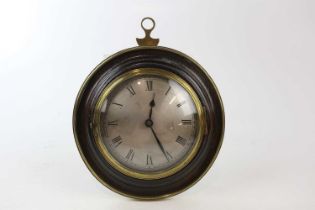 A Regency sedan wall clock, with brass border, the silvered dial set with Roman numerals, diameter