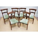 A set of six Regency mahogany bar back dining chairs with drop-in seats and sabre legs (4+2).