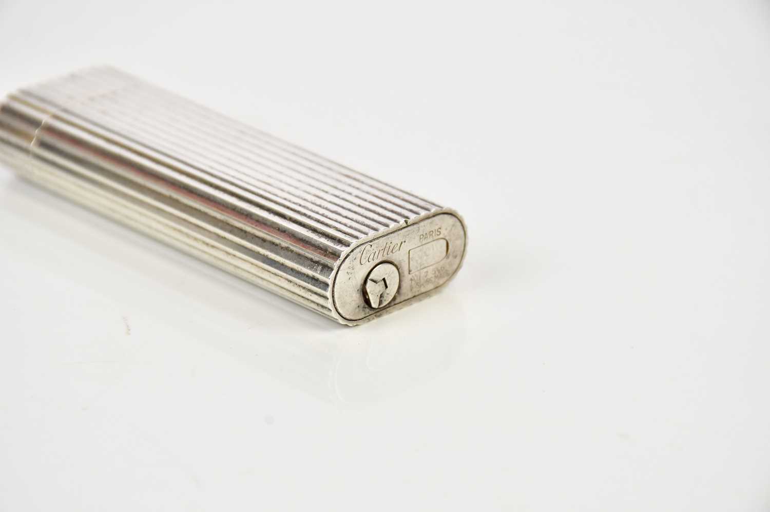CARTIER; a silver plated cigarette lighter, reference number 107569. - Image 3 of 3