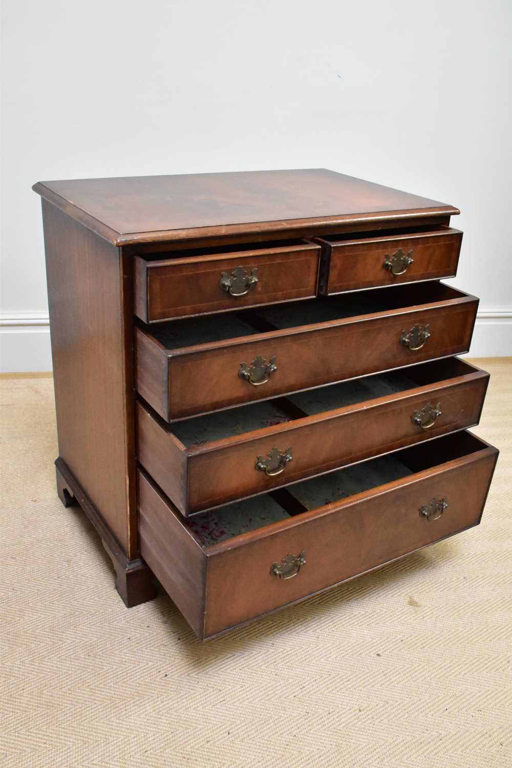 A reproduction mahogany chest of two short over three long drawers on bracket feet, width 79cm,