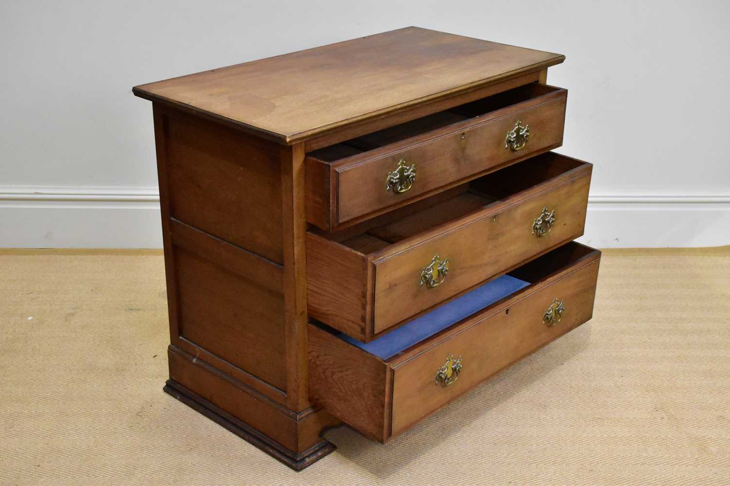 A late Victorian mahogany chest of three drawers on shaped bracket feet, width 98cm, depth 54cm, - Image 2 of 2