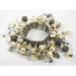 ASKEW, LONDON; a silver tone five strand ball bead bracelet with faux pearls, glass crystal and