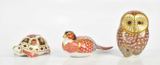 ROYAL CROWN DERBY; an animal form paperweight modelled as an owl, together with two similar animal