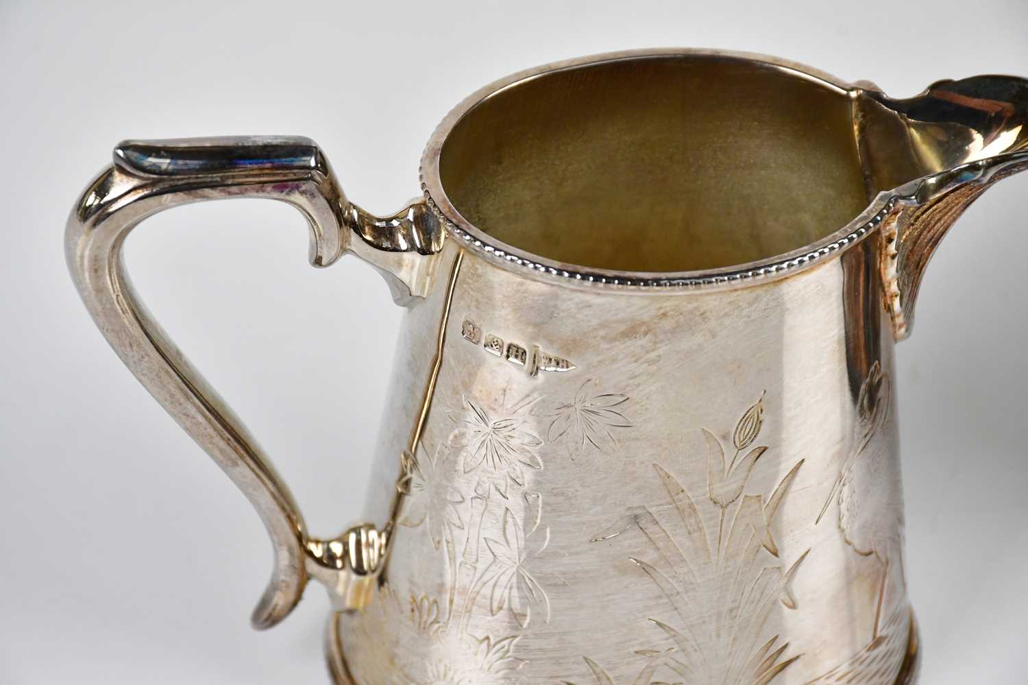WALKER & HALL; a silver plated twin handled sugar bowl and cream jug chased with cranes in the - Image 2 of 3