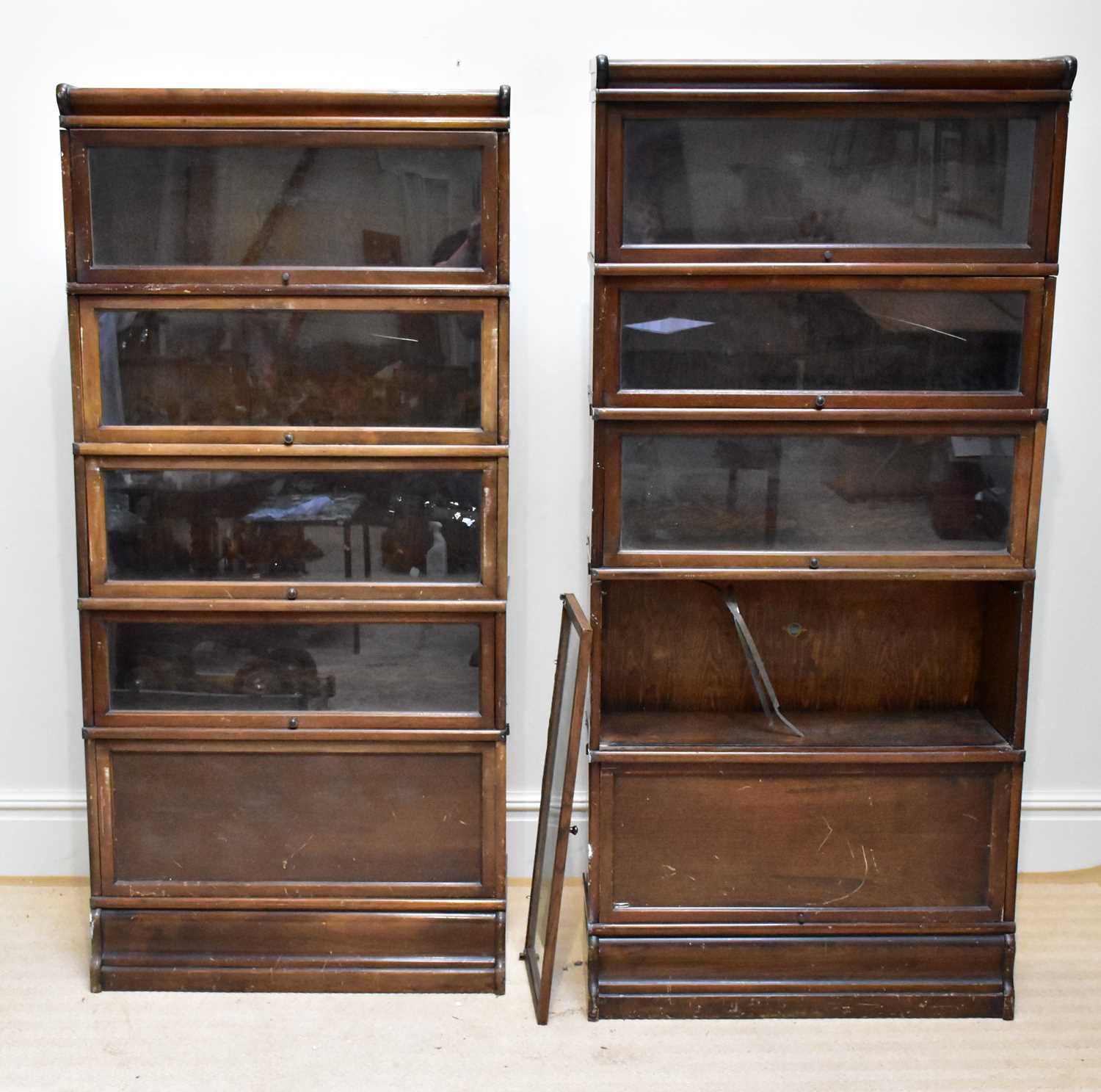 GLOBE WERNICKE; two metal bound five tier stacking bookcases with up and over doors, height of