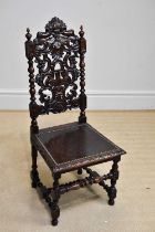 An early 20th century carved oak Carolean style hall chair.