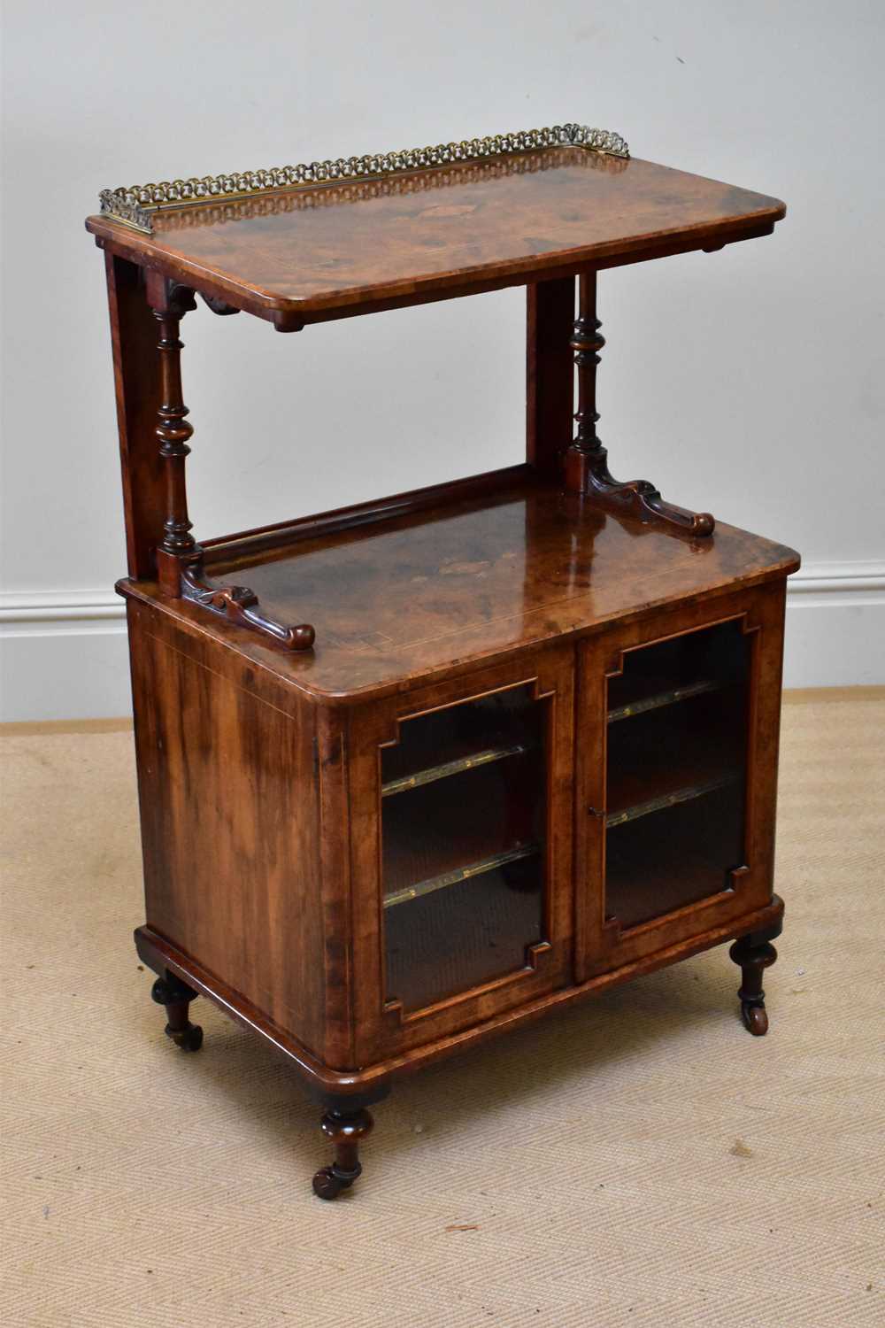 A Victorian inlaid walnut music cabinet with two glazed doors, height 105cm, width 67cm, depth