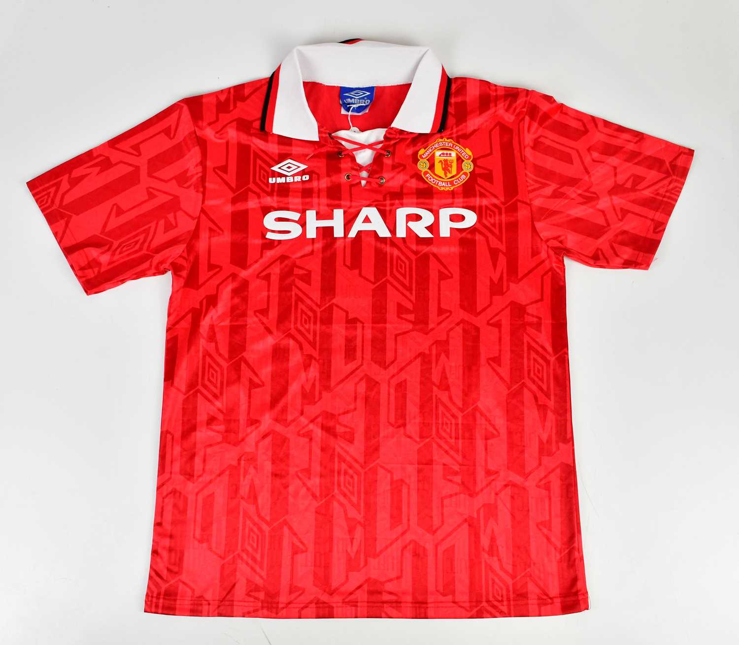 ERIC CANTONA; a 92/97 Manchester United retro style football shirt, signed to the reverse, size L.