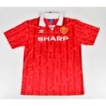 ERIC CANTONA; a 92/97 Manchester United retro style football shirt, signed to the reverse, size L.
