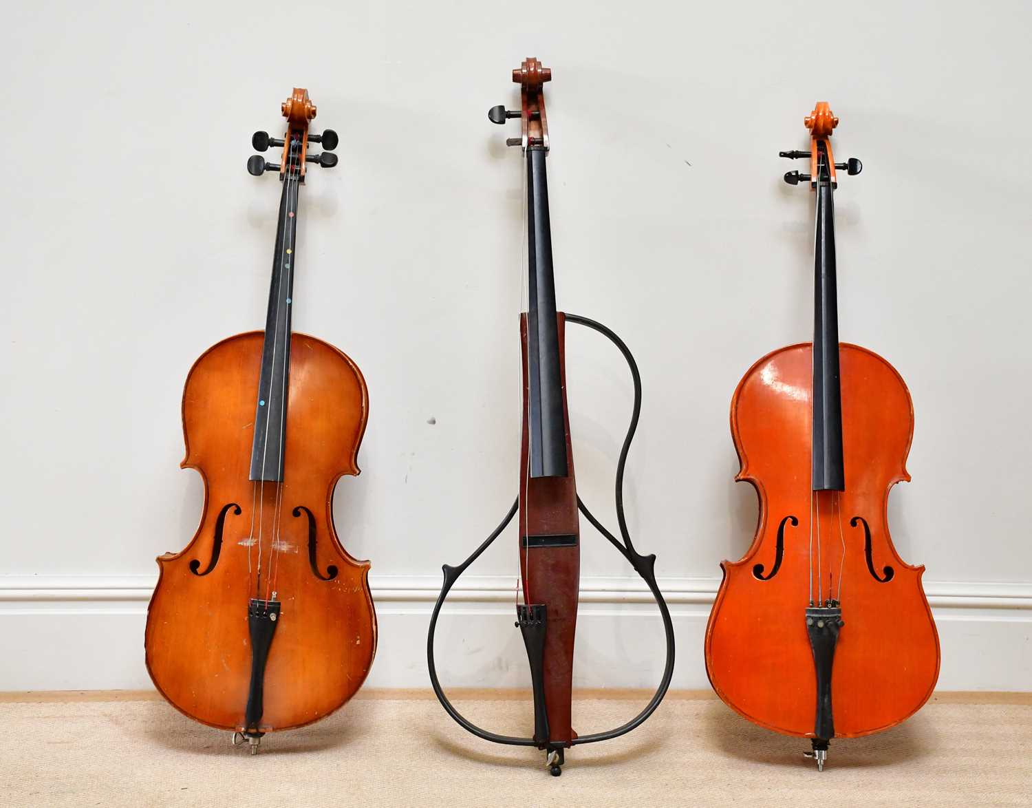 A modern Rudall, Carte & Co 'Sonata' cello, a Chinese student's cello (af) and a practice cello (