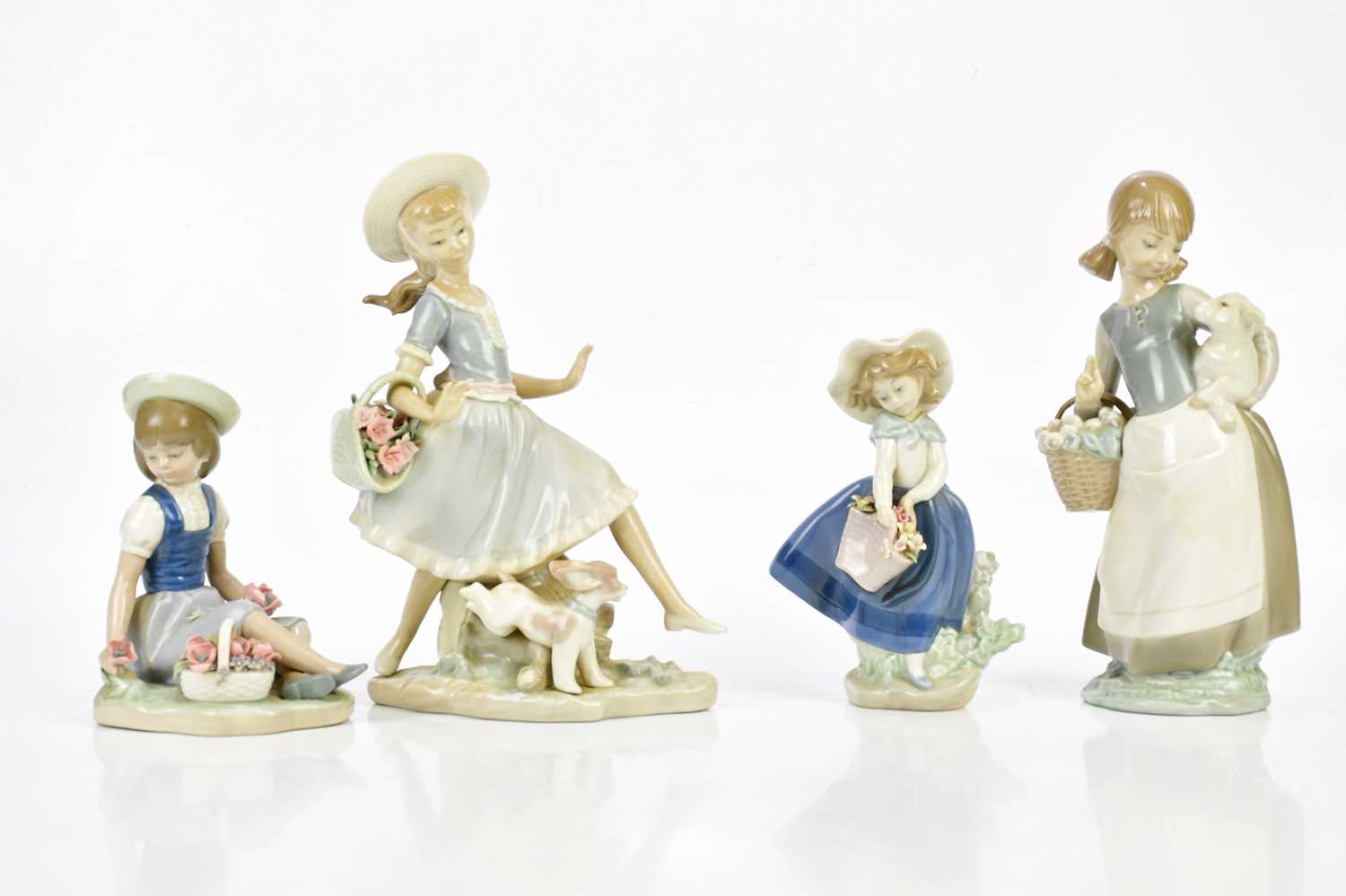 LLADRÓ; four figures including a girl walking with basket of flowers and puppy, height 25cm, etc (