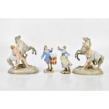 A pair of 19th century Meissen figures representing a drummer man and a girl with flowing dress,