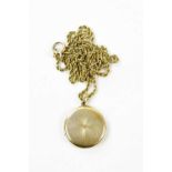 A 15ct yellow gold locket with engine turned decoration suspended on a yellow metal rope link chain,