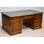 A 19th century oak partner's desk with gilt tooled leather top, drawers and cupboard doors, width