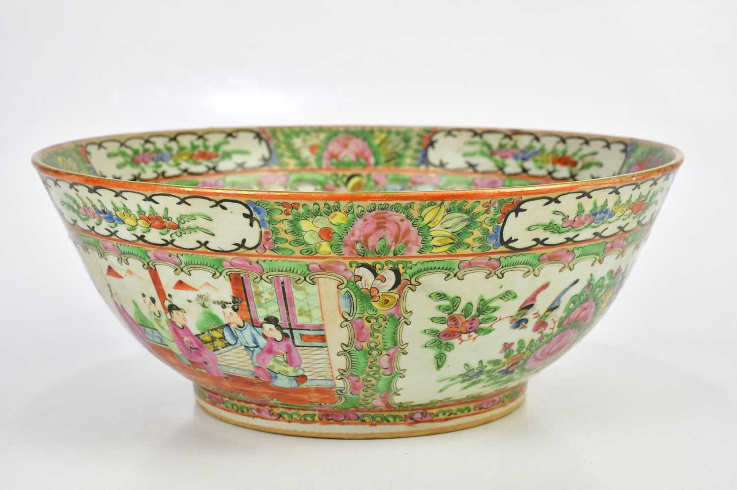 An early 20th century Chinese Famille Rose Canton footed bowl, decorated in panels with figures,