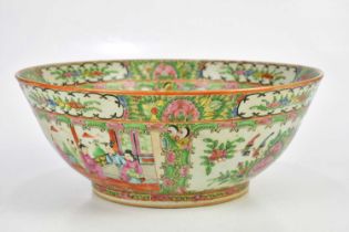 An early 20th century Chinese Famille Rose Canton footed bowl, decorated in panels with figures,