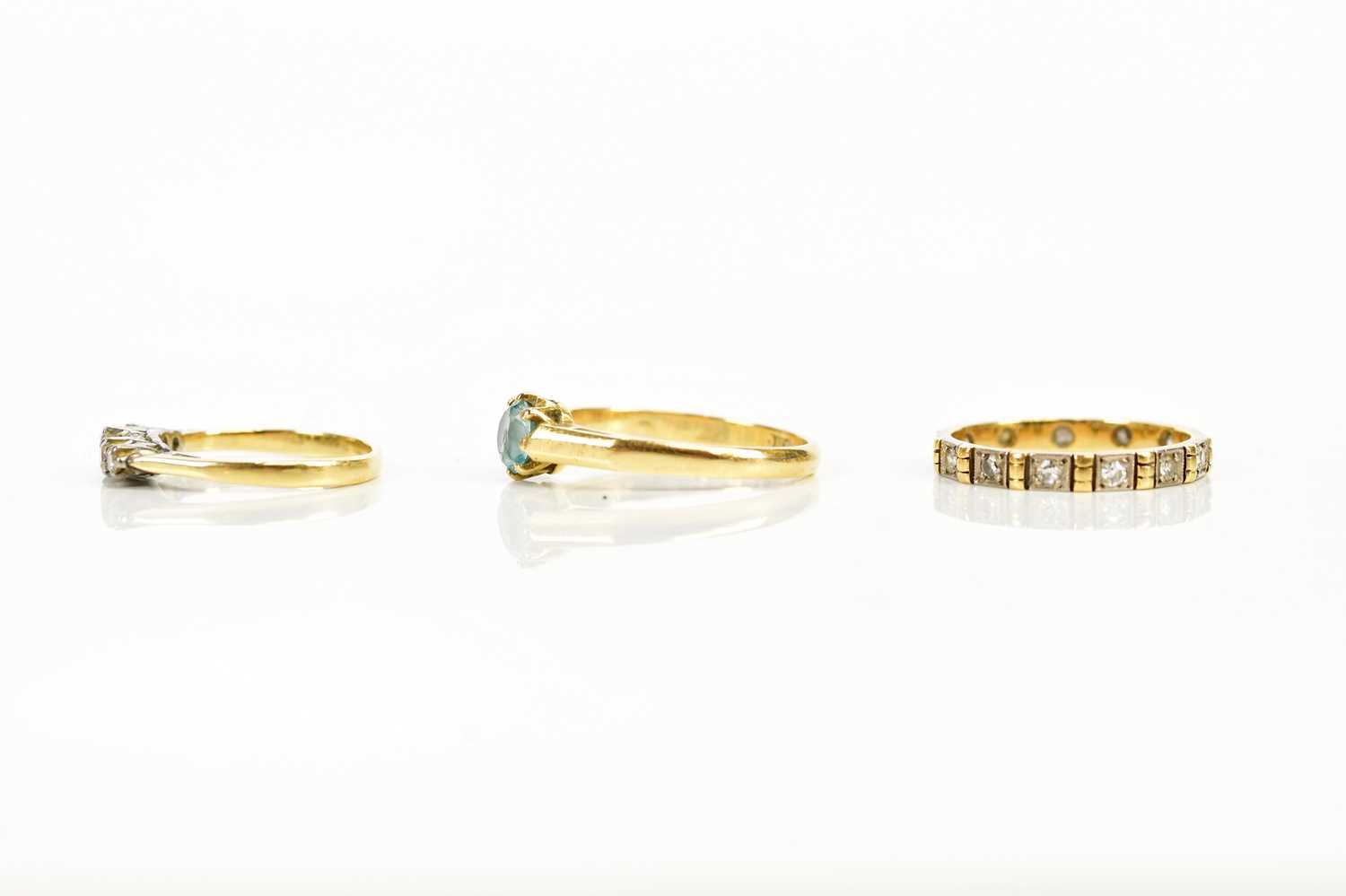 An 18ct dress ring set with a blue coloured stone, size N, a yellow metal diamond set five stone - Image 2 of 3