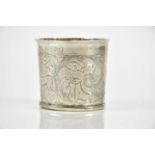 An 18th century unusual white metal beaker, chased with stag, doe and landscape scene, inscribed MED