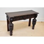 A 19th century Flemish style carved oak side table, height 88cm, width 121cm, depth 47cm.