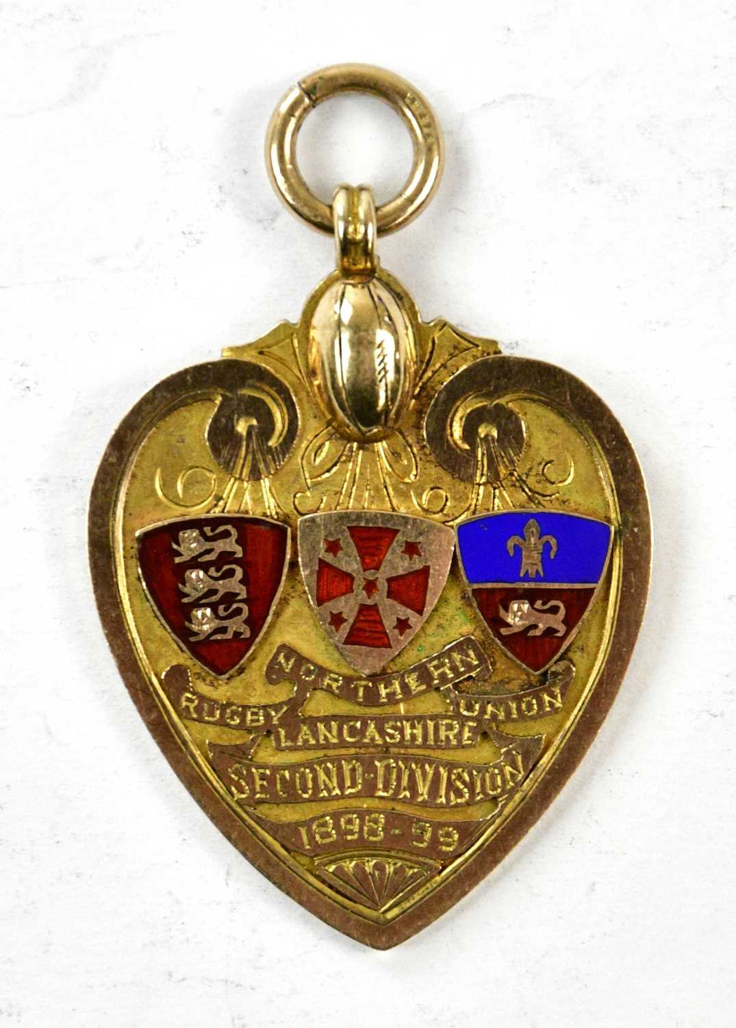 RUGBY LEAGUE INTEREST; a Victorian 9ct gold and enamel heart shaped medal 'Northern Rugby Union