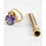 A 9ct gold dress ring set with amethyst coloured stones, size T, and a 9ct gold propelling pencil
