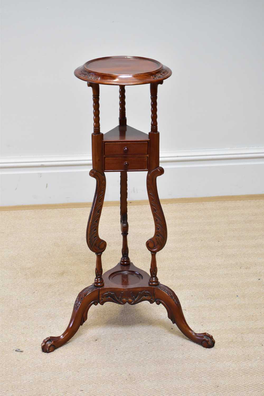 A reproduction mahogany wig stand with two drawers, height 86cm.