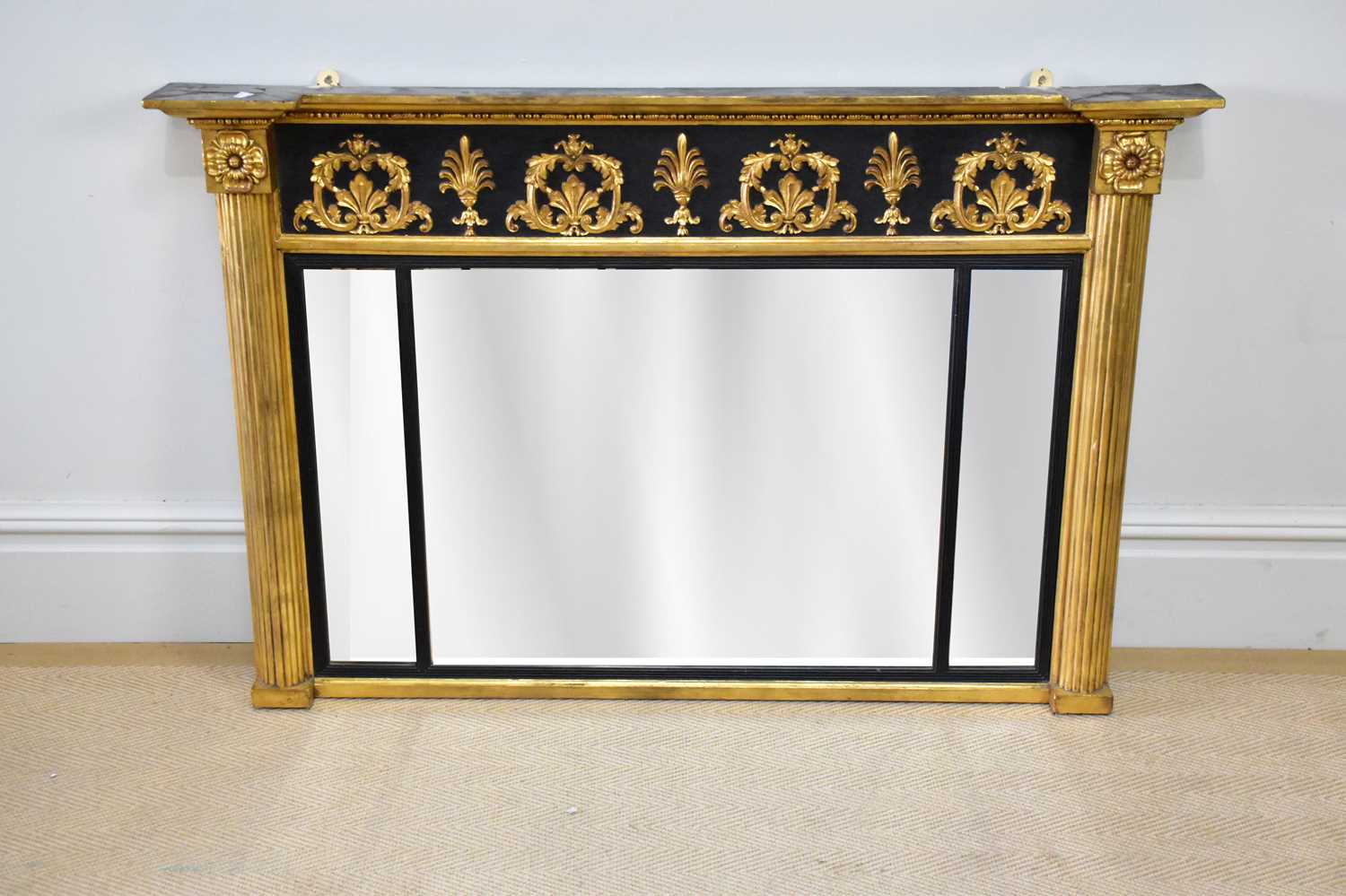 A 19th century gilt wood and gesso overmantel mirror, height 81cm, width 123cm. Provenance: