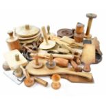 A collection of 19th/early 20th century treen including breadboards, butter pats, etc.