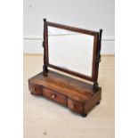 A 19th century mahogany toilet mirror, with three drawers, height 59cm, width 54cm, depth 22cm.