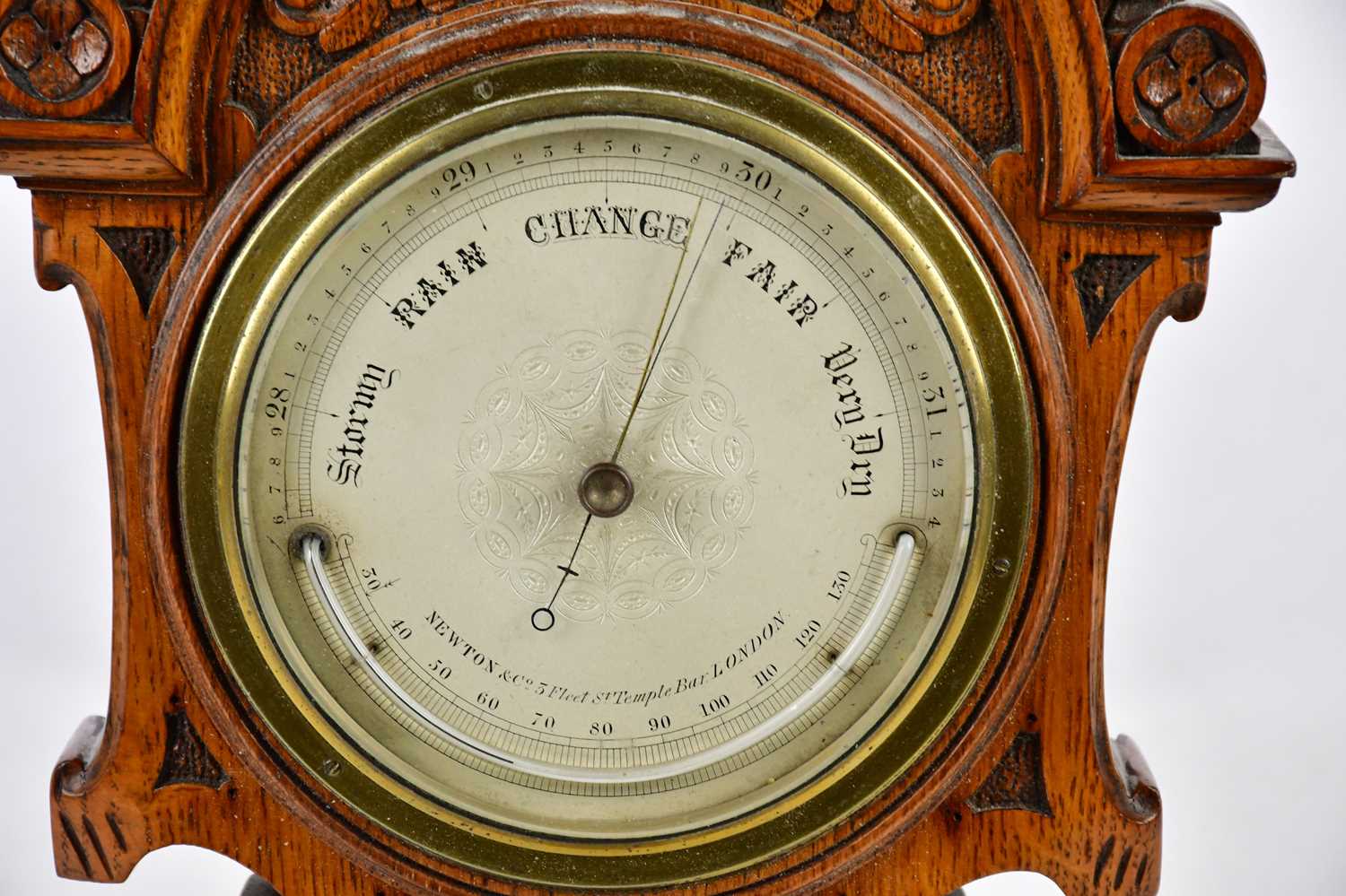 A late Victorian carved oak barometer, the silvered dial inscribed 'Newton & Co, Fleet Street, - Image 2 of 4