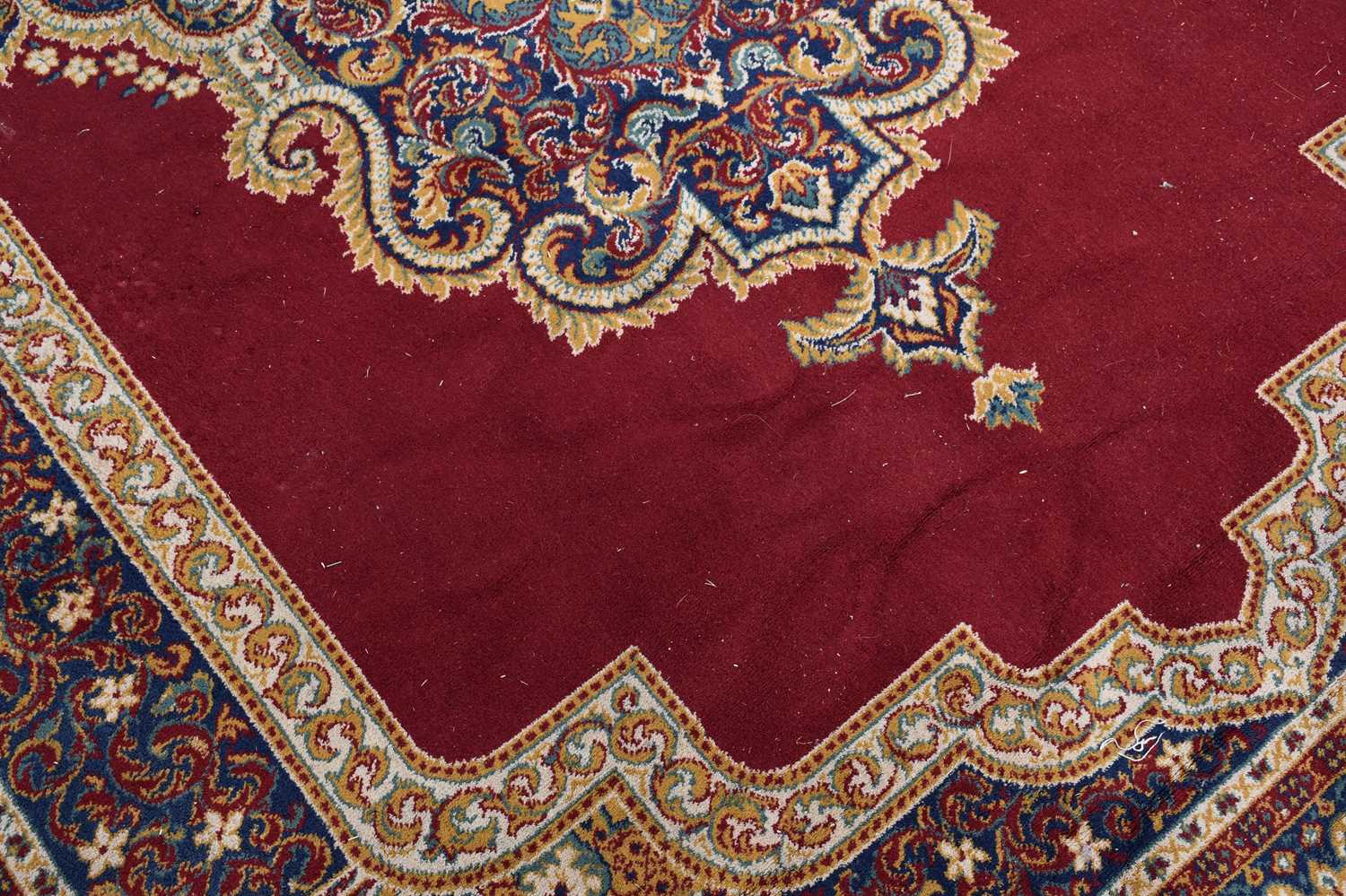 A red ground machined Tabriz style carpet, 347 x 249cm. - Image 2 of 3