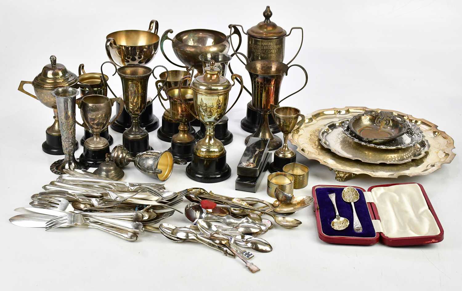A collection of assorted silver plated items, including trophy cups, flatware, etc.