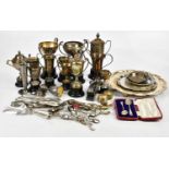 A collection of assorted silver plated items, including trophy cups, flatware, etc.