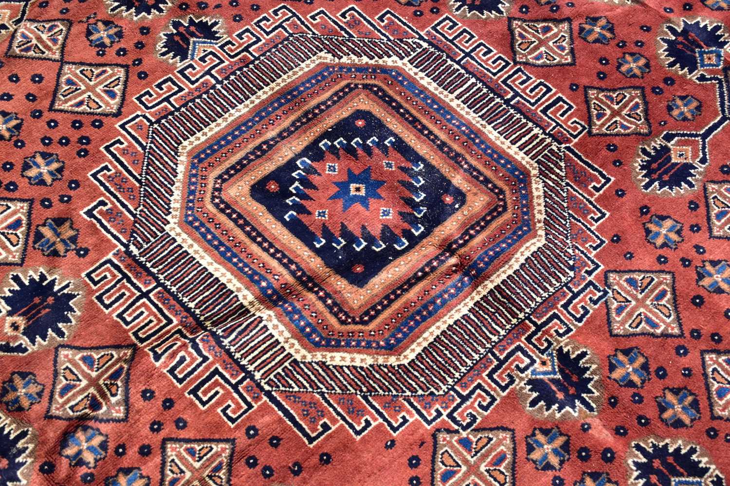 An orange ground wool carpet with central geometric pattern, 287 x 215cm. - Image 2 of 3