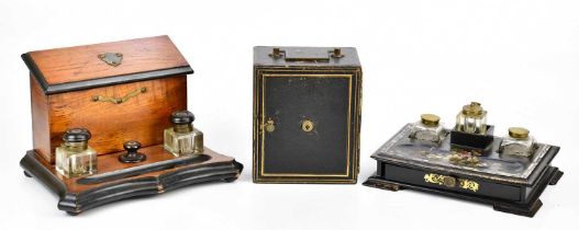 A Victorian papier-mâché desk stand with three detachable glass inkwells and single drawer, width