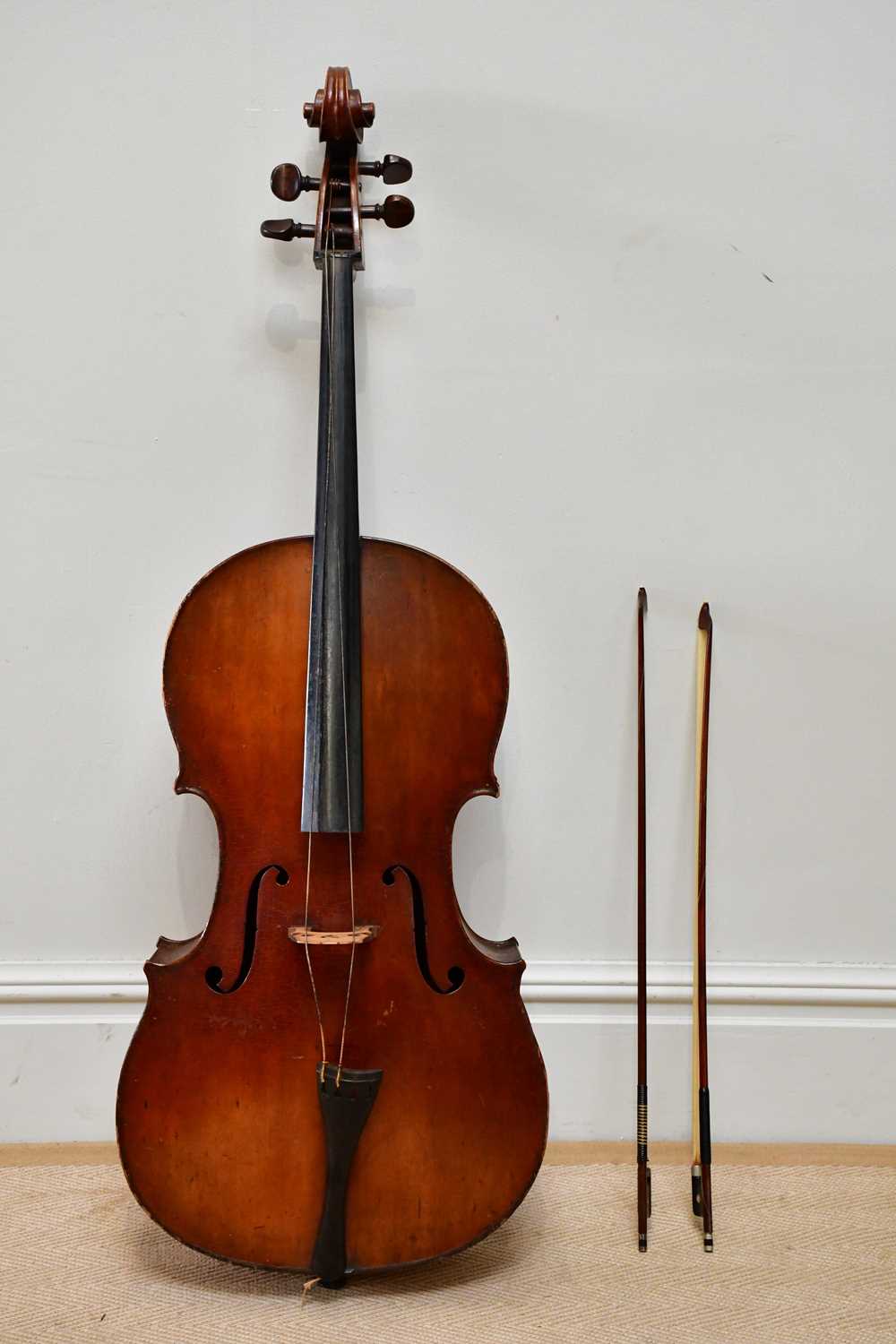 A full size German violoncello with two-piece back, length 75cm, unlabelled, with a silver mounted
