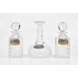 Three cut glass decanters with hallmarked silver decanter labels, 'Gin, 'Sherry' and 'Whisky' (6).