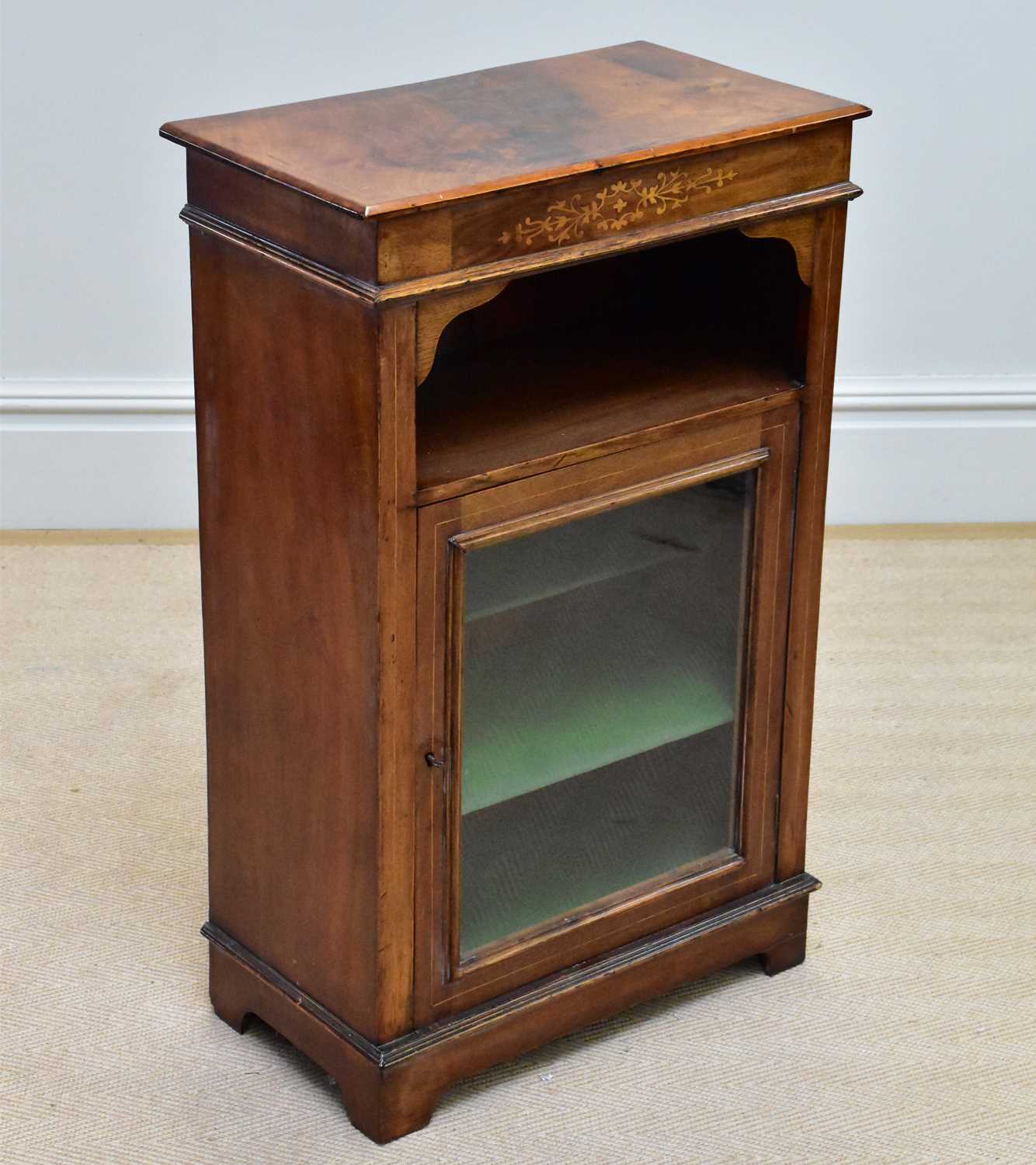 An Edwardian inlaid walnut music cabinet with single glazed door, height 90cm.