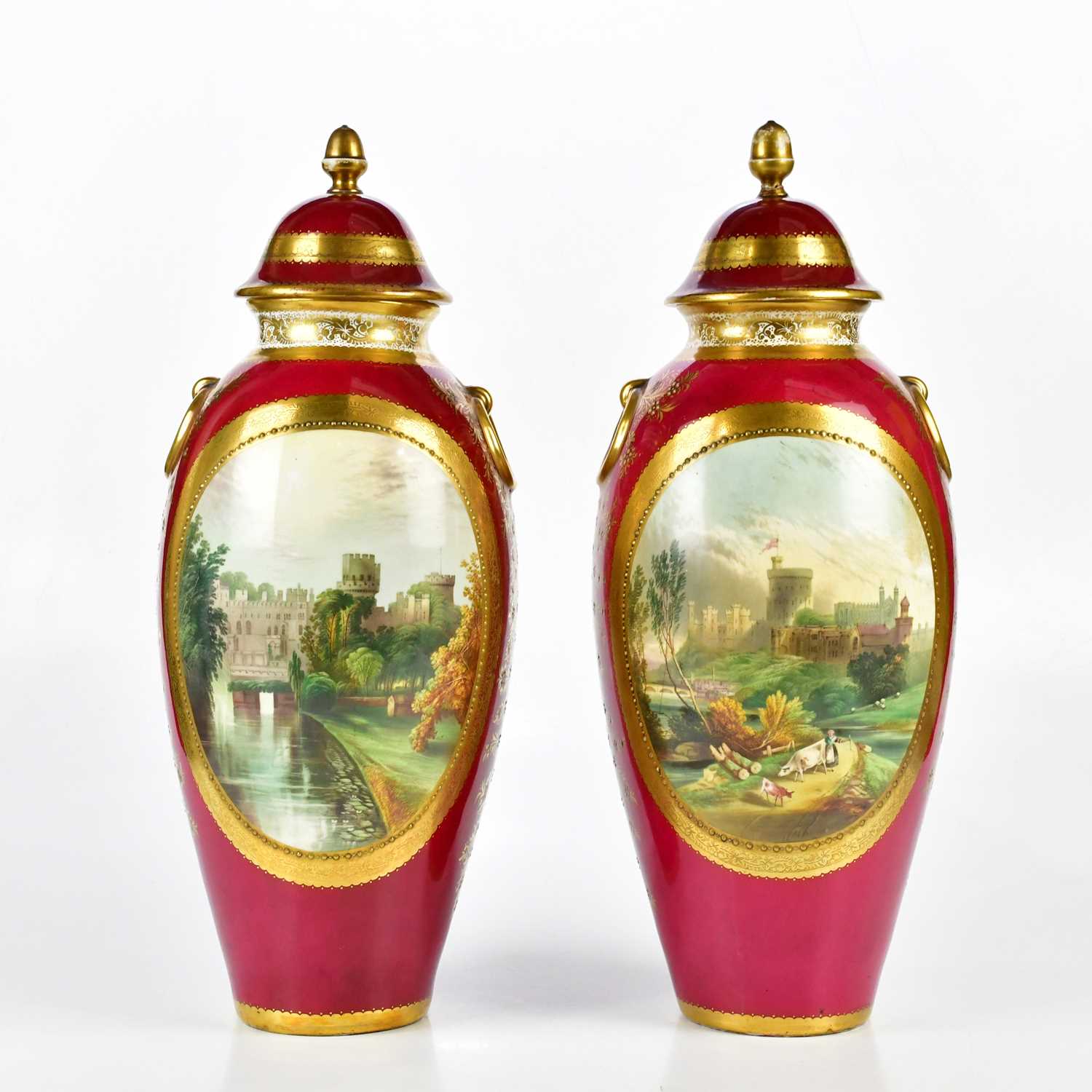 A pair of 19th century Staffordshire ovoid vases and covers, hand painted with scenes of Windsor