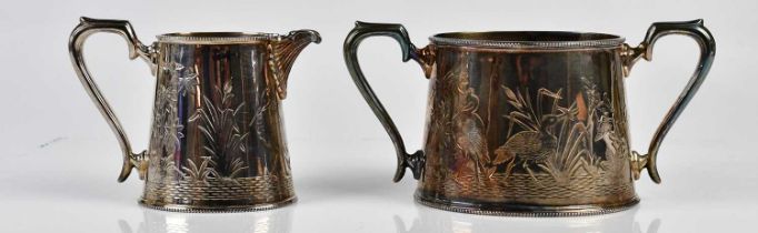 WALKER & HALL; a silver plated twin handled sugar bowl and cream jug chased with cranes in the