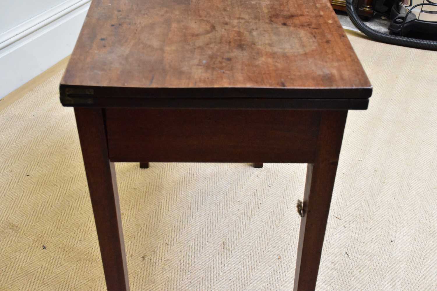 A Georgian mahogany fold-over two drawer tea table on square legs, width 86cm, depth 42cm, height - Image 3 of 4
