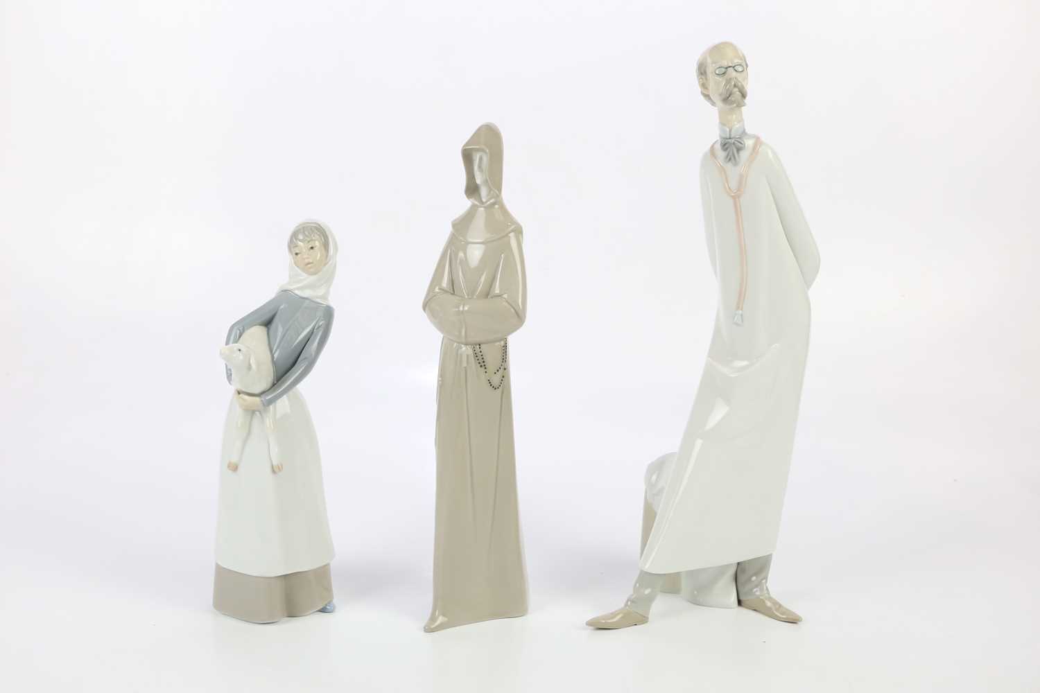 LLADRO; a figure of a doctor, height 39cm, with a Lladro shepherdess and a Lladro type figure of a